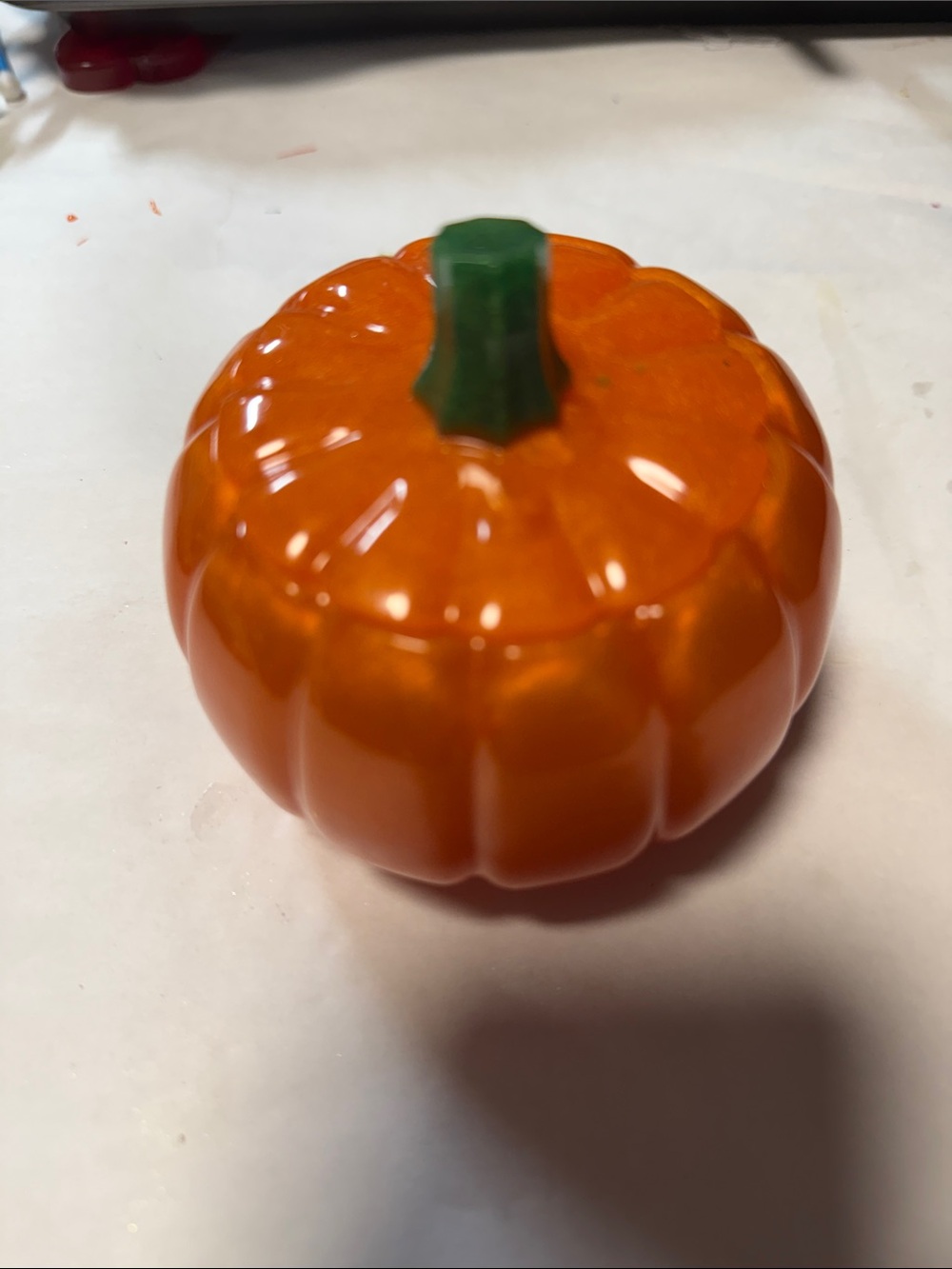Glossy Orange Resin Pumpkin Accent with Green Stem